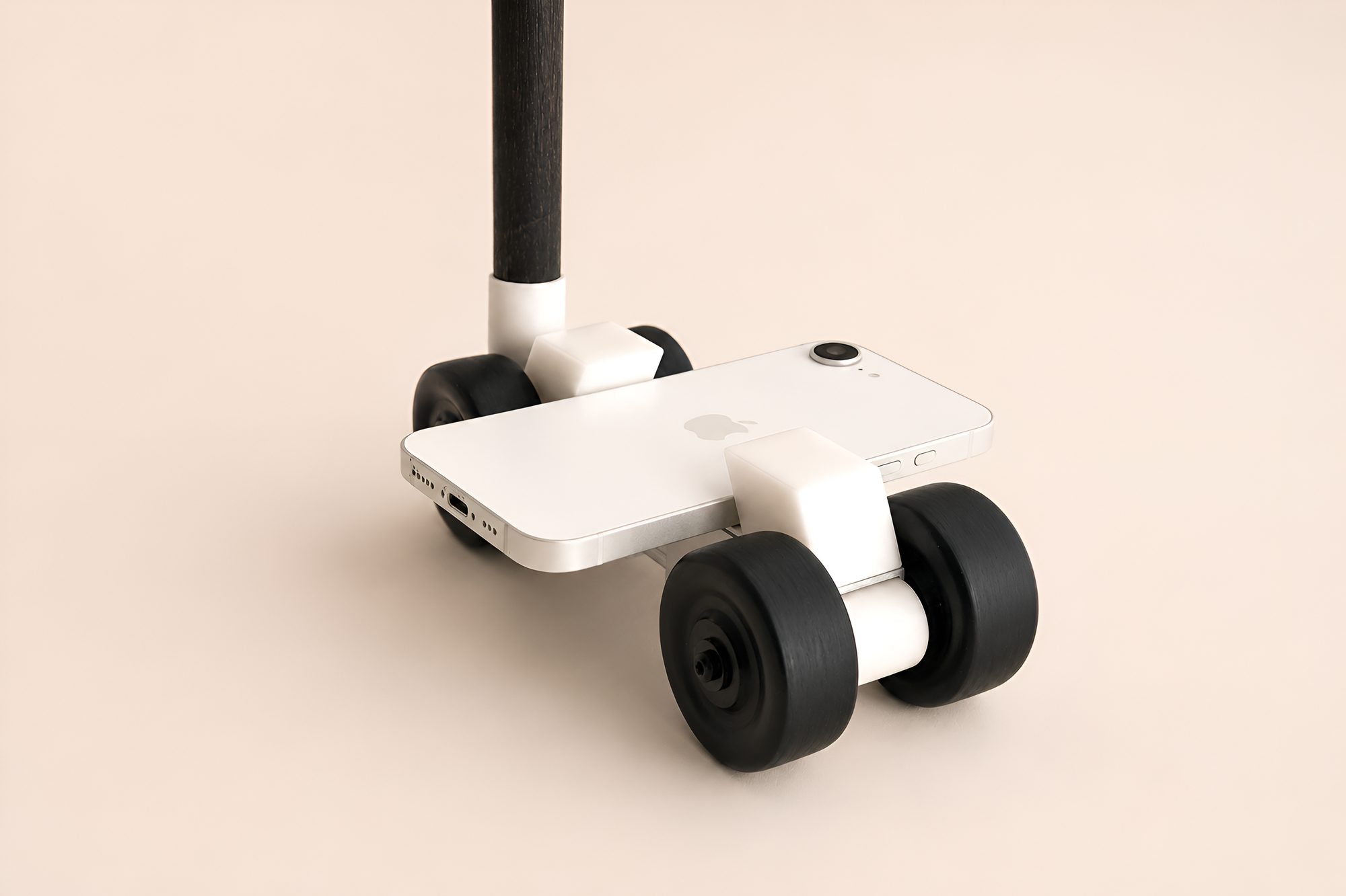 Close view of the kit with a phone mounted on four wheels